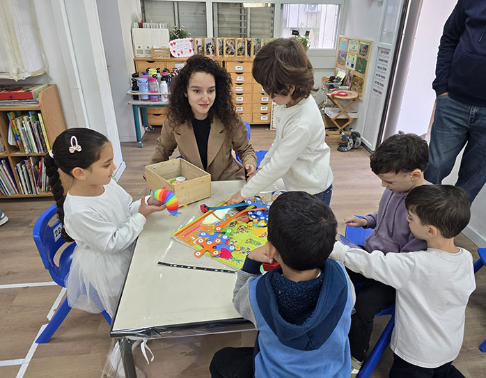 The kids at work with their student tutor